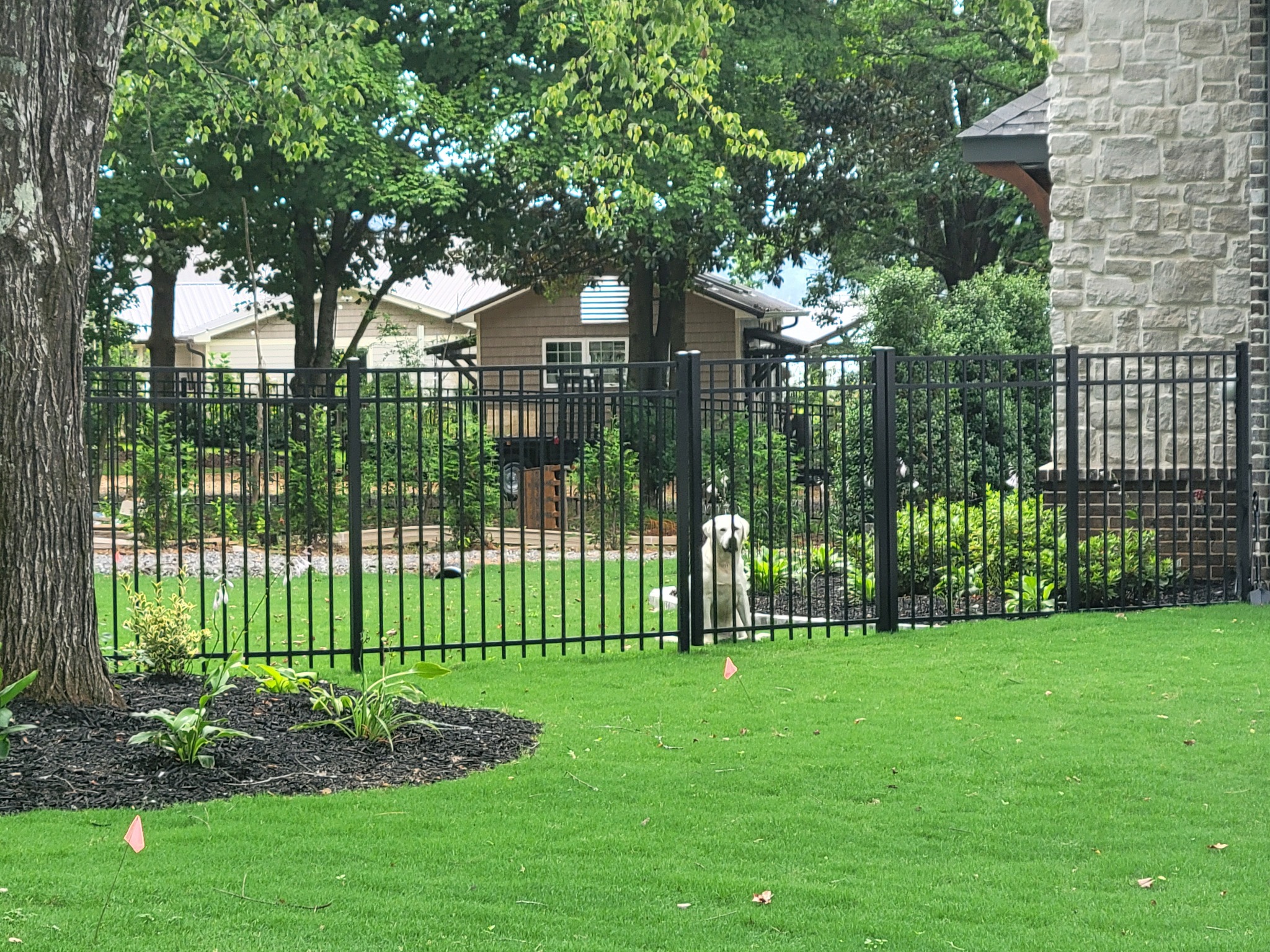 Pet-friendly aluminum fence in Guntersville, Alabama installed by Hooks Fence Company