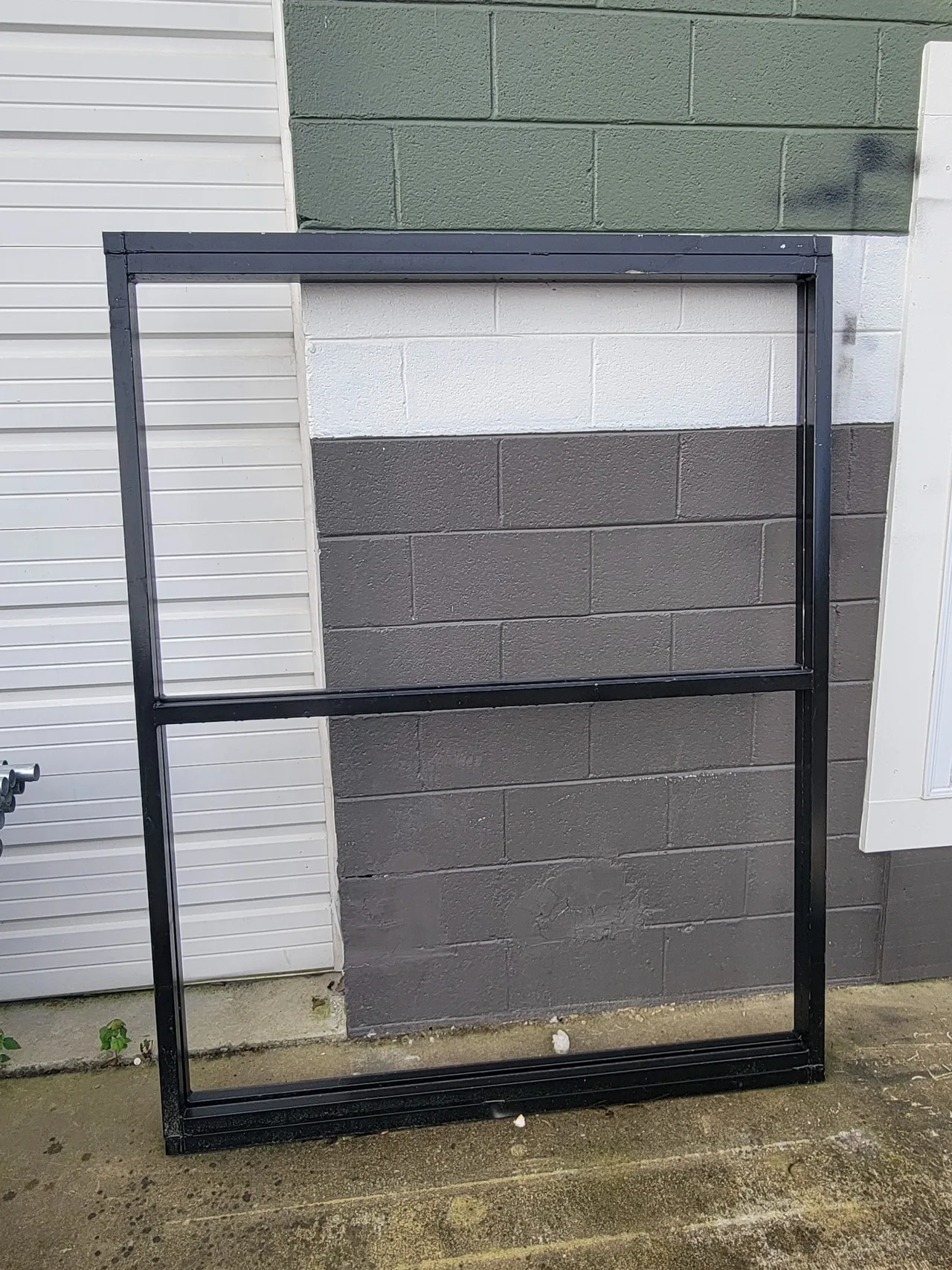 Finished black 2-inch square steel tubing gate frame fabricated by Hooks Fence Company