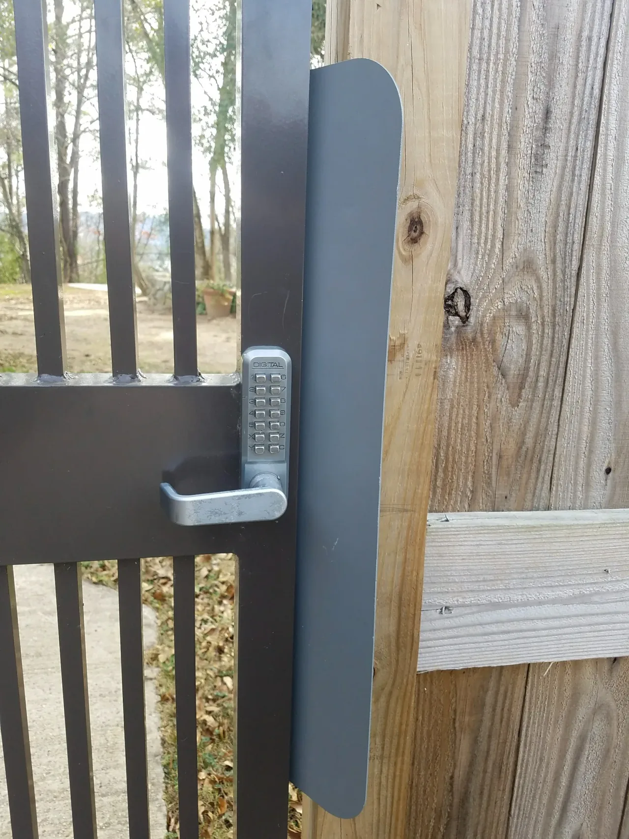 Combination lock access hardware on security gate in Guntersville Alabama