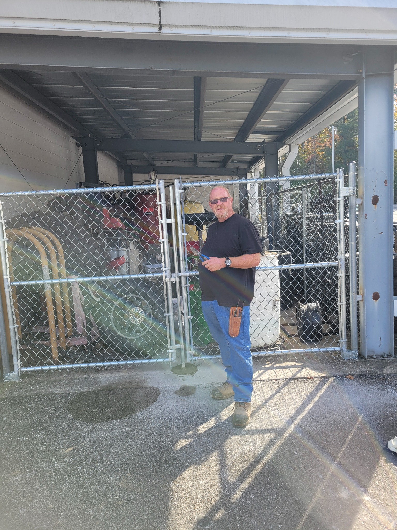 Commercial chain-link equipment enclosure in Albertville, Alabama installed by Hooks Fence Company