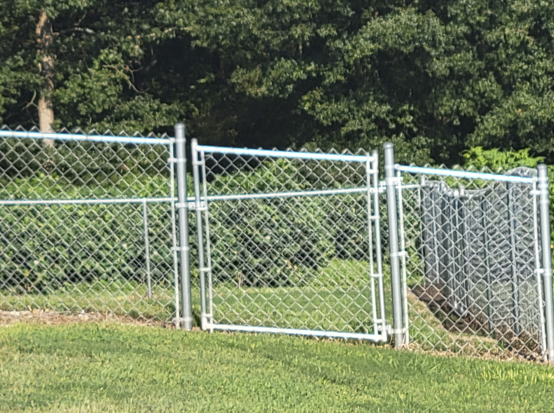 Custom chain-link gate built for sloped land in Blountsville Alabama