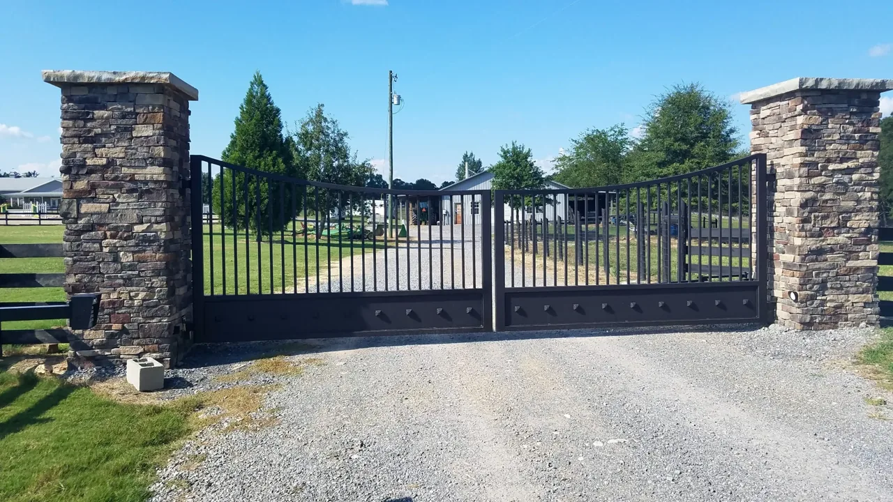 Custom ornamental estate driveway gate in Albertville Alabama by Hooks Fence Company