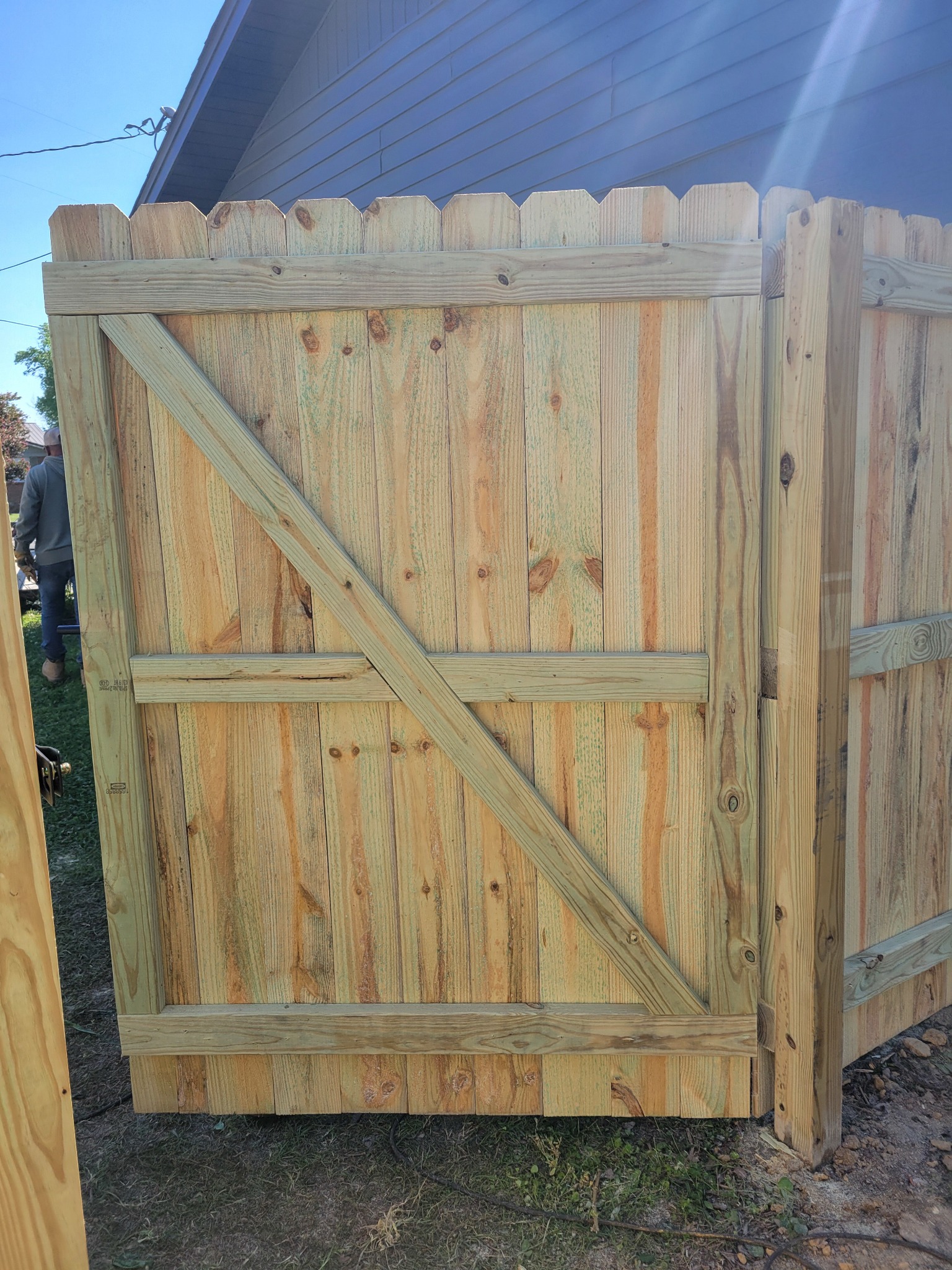 Wood gate with metal frame in Attalla, Alabama installed by Hooks Fence Company