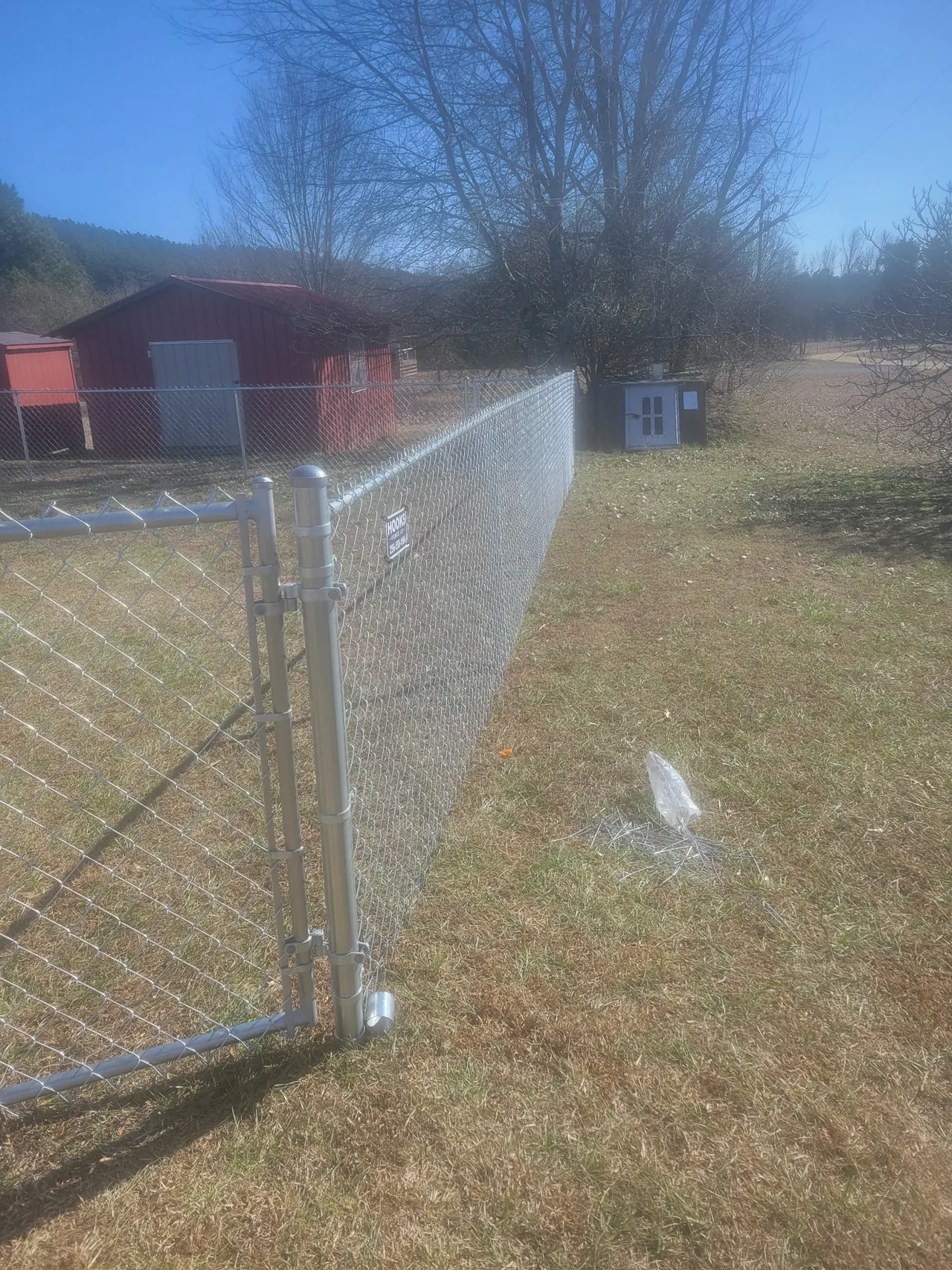 Galvanized chain-link fence and walk gate installed by Hooks Fence Company in Oneonta Alabama