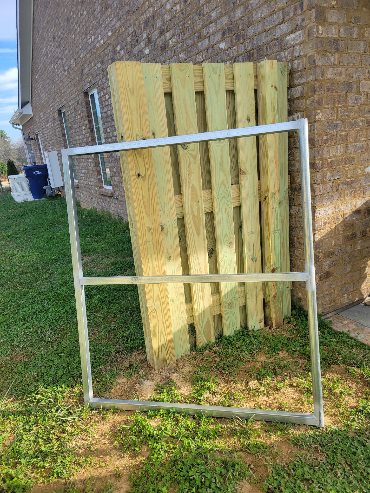 Heavy-duty metal-framed wood gate in Guntersville, Alabama installed by Hooks Fence Company