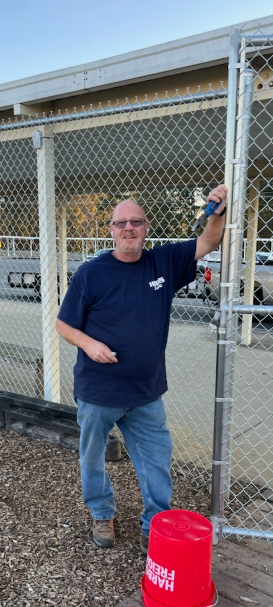 Hooks Fence Company owner Kevin Hooks at a commercial chain-link fence project in Alabama