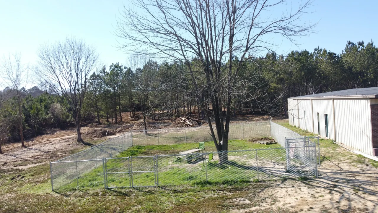 Chain-link dog play yard built by Hooks Fence Company for the Marshall County Animal Shelter in Alabama