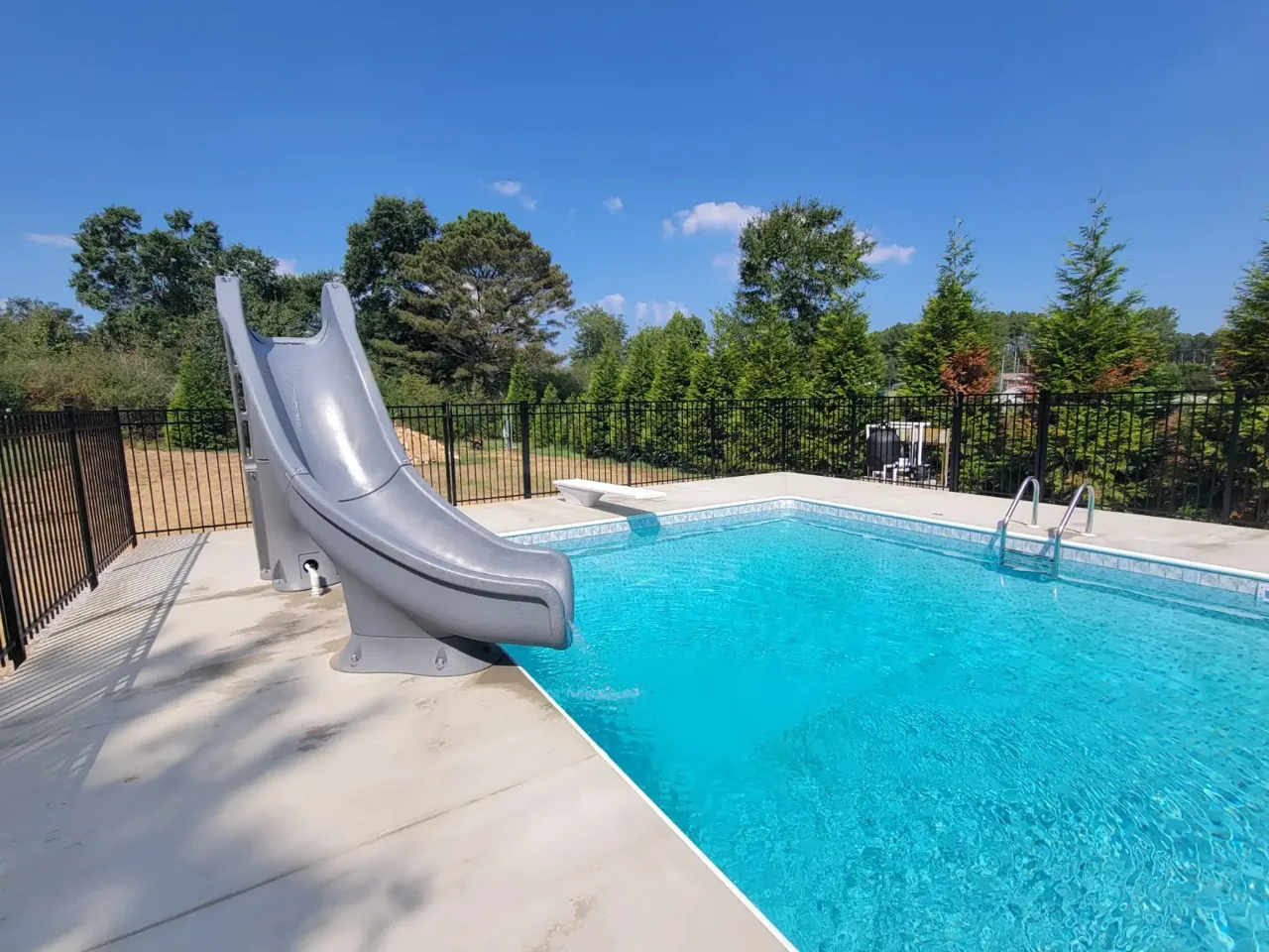 Completed black no-dig aluminum ornamental pool fence in Boaz, Alabama installed by Hooks Fence Company