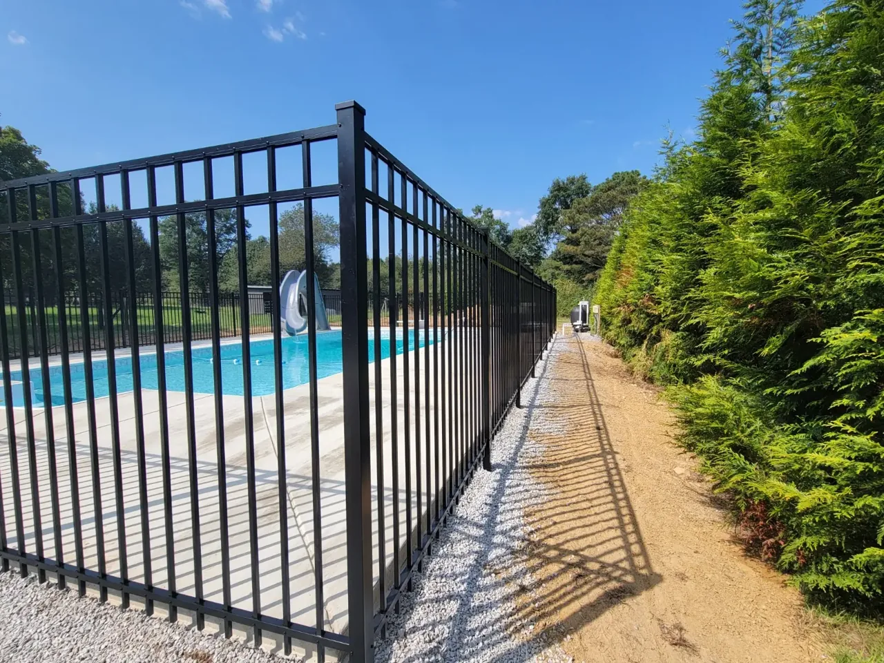 Corner view of completed no-dig ornamental pool fence in Boaz Alabama