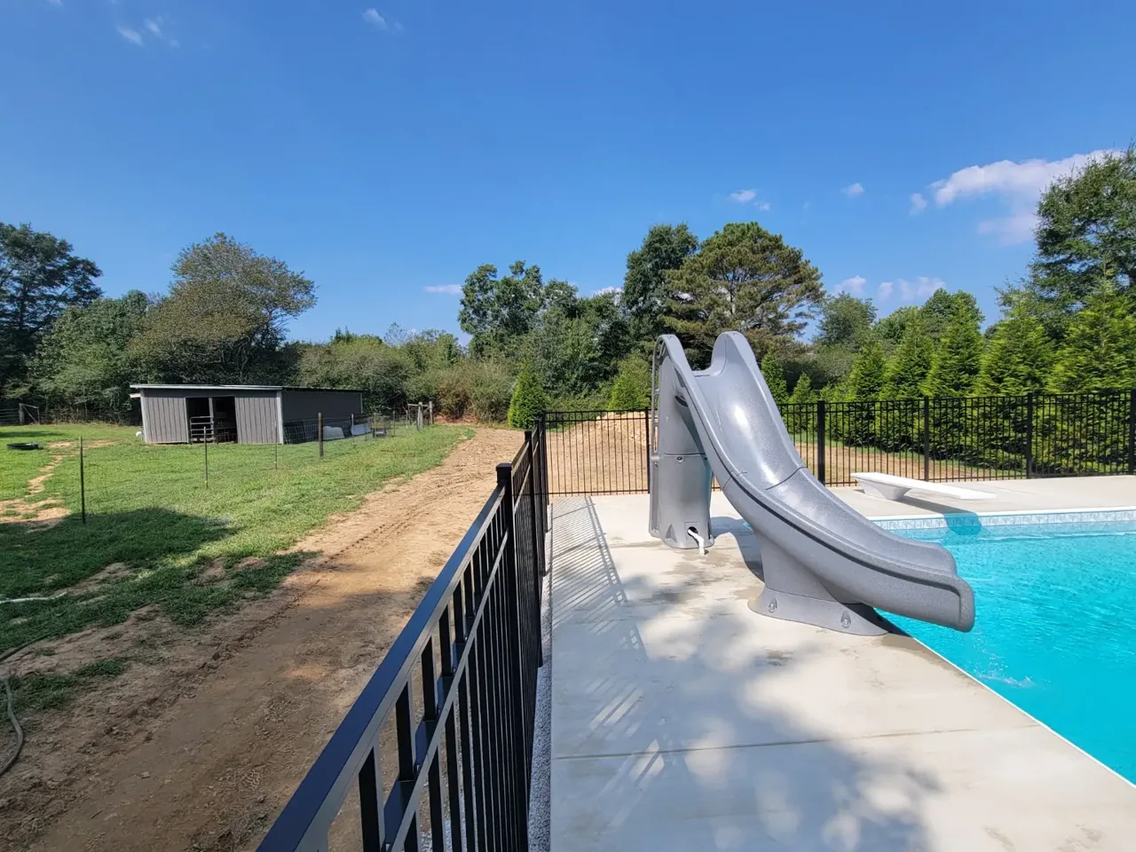 Actual black aluminum pool fence installed by Hooks Fence Company in Boaz Alabama
