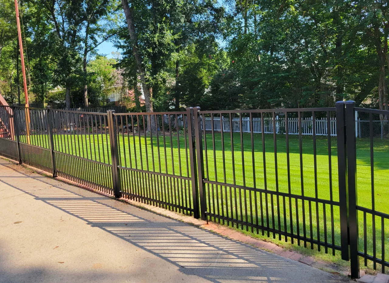 Ornamental fence with puppy pickets in Trussville, Alabama installed by Hooks Fence Company