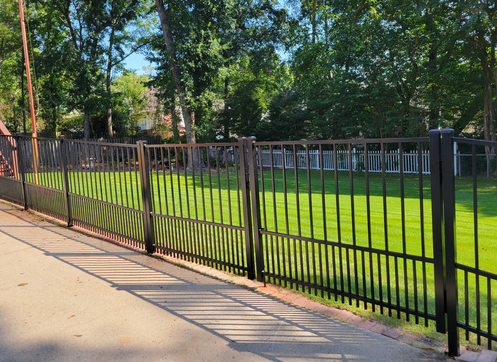Ornamental fence with puppy pickets in Trussville, Alabama installed by Hooks Fence Company