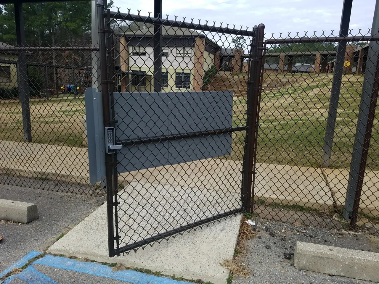 Controlled access chain-link security gate in Guntersville Alabama by Hooks Fence Company