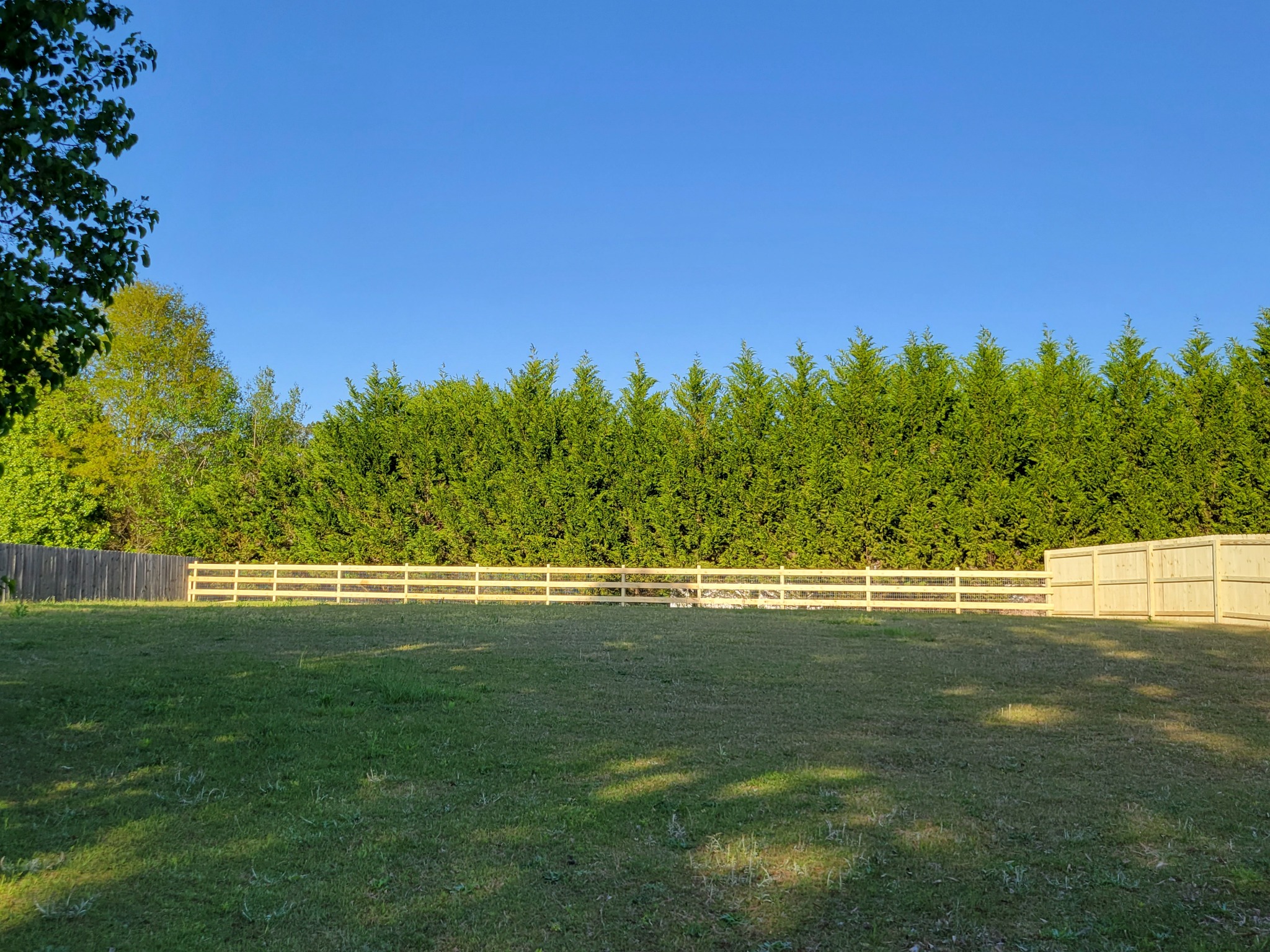 Privacy and ranch-style fence combination in Ashville, Alabama installed by Hooks Fence Company