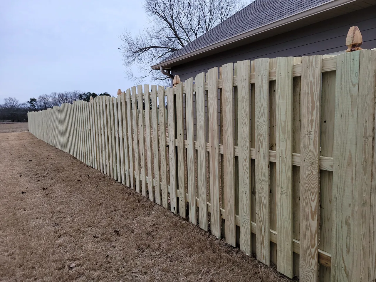 Decorative shadow-box wood fence in Oneonta, Alabama installed by Hooks Fence Company