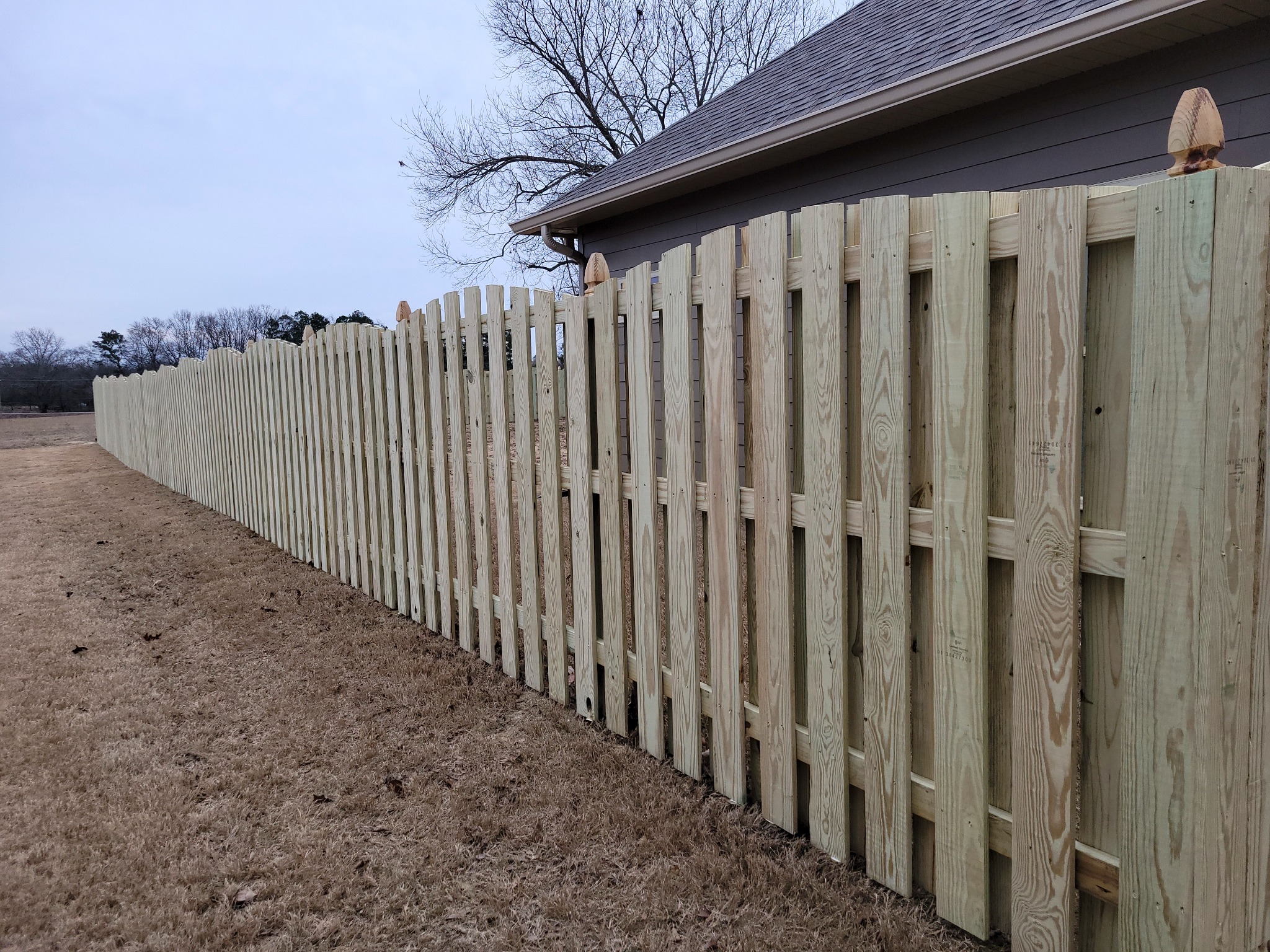 Decorative shadow-box wood fence in Oneonta, Alabama installed by Hooks Fence Company