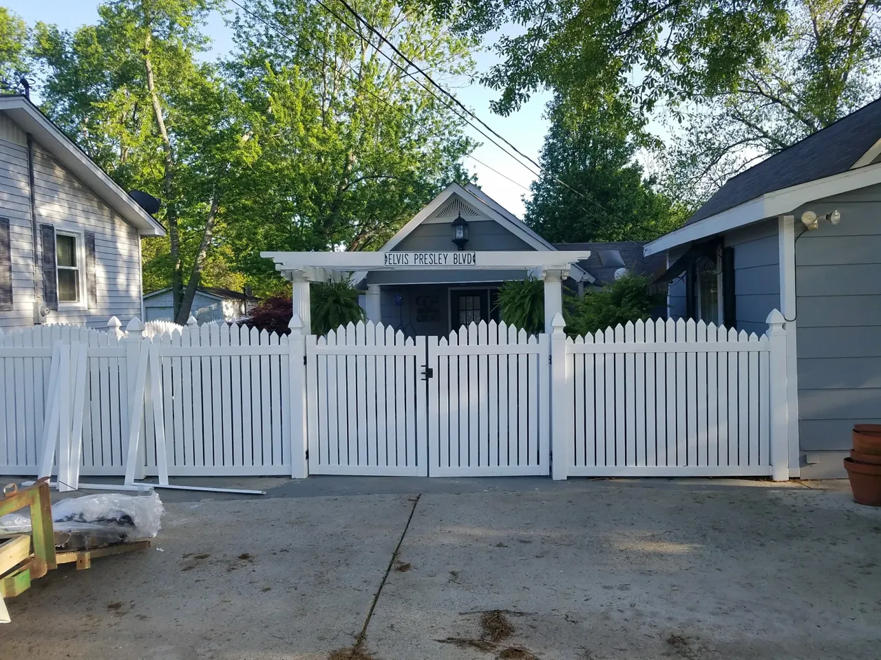 White vinyl picket double gate installed in Albertville Alabama by Hooks Fence Company