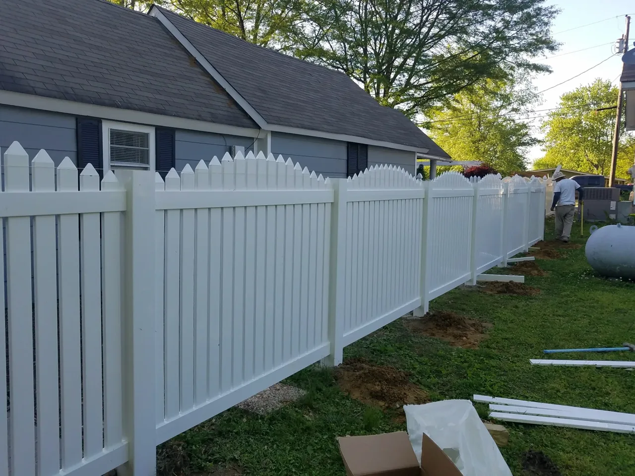 White vinyl picket fence installed in Albertville Alabama by Hooks Fence Company