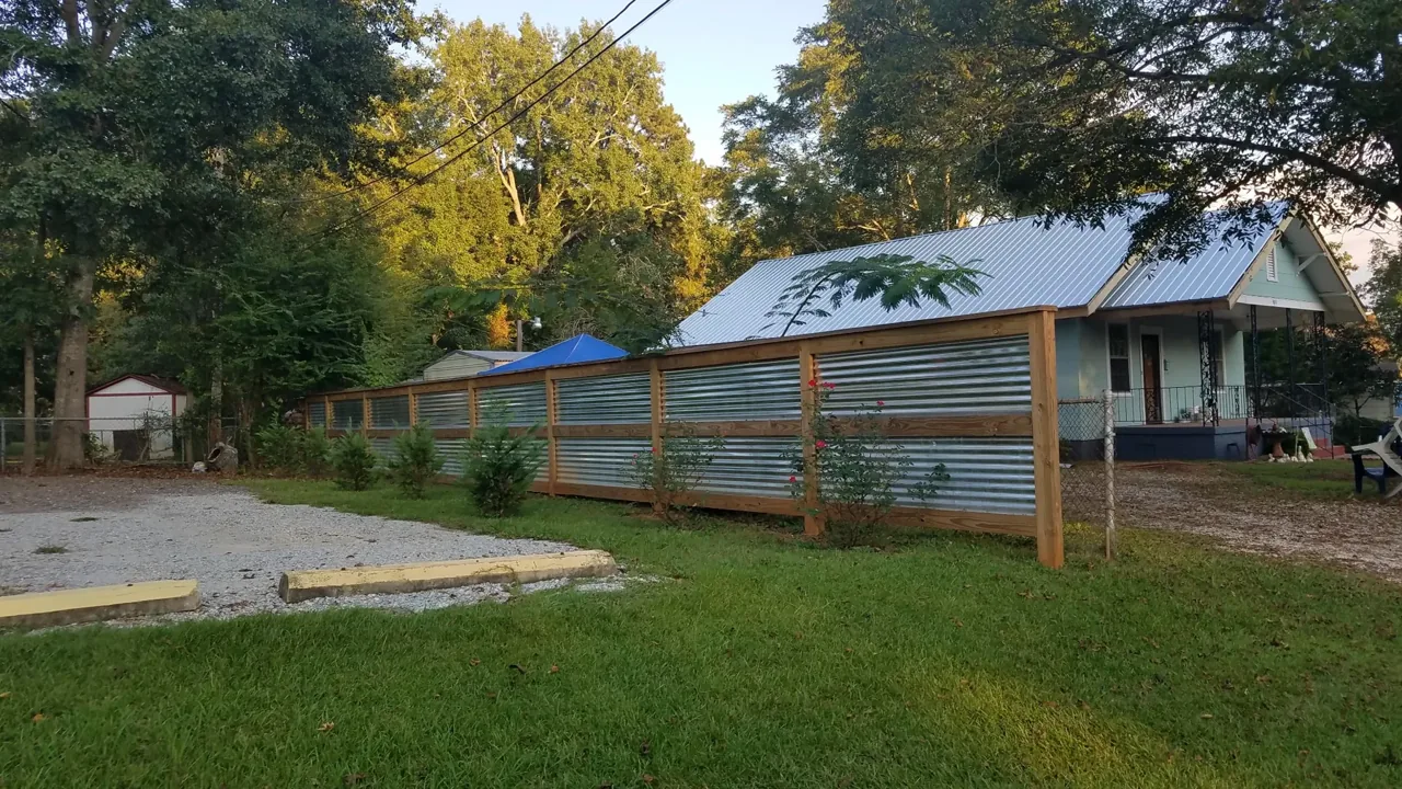 Wood framed corrugated metal privacy fence in Albertville Alabama by Hooks Fence Company